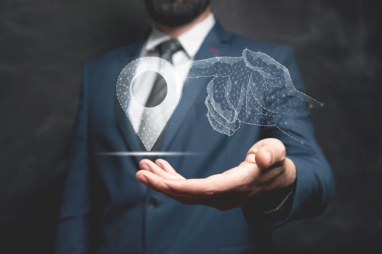 A hand from the network clicks on the GPS. Man holding in his hand