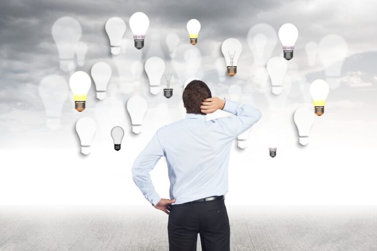 man-touching-her-head-looking-bulbs